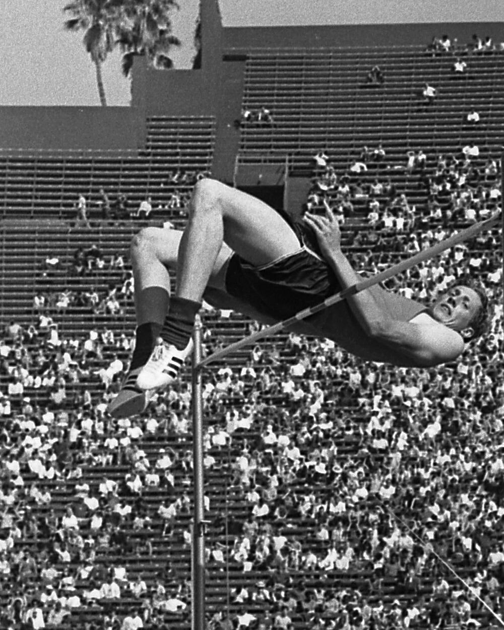 Dick Fosbury clearing the bar with his back-first technique at the 1968 Olympic trials
